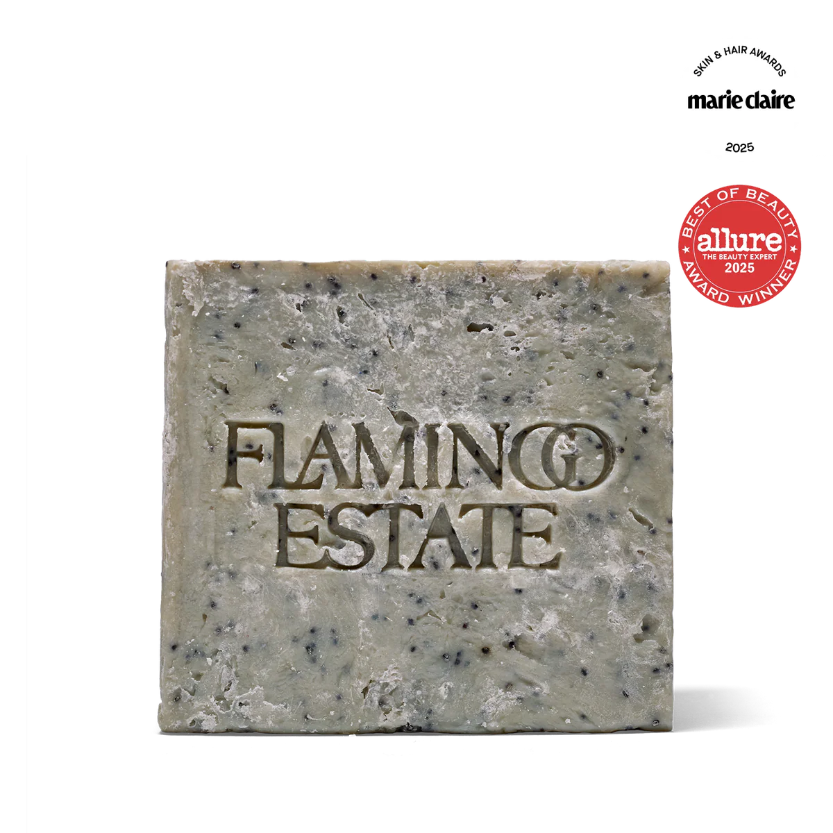 Bar of soap with 'Flamingo Estate' branding and awards on a white background