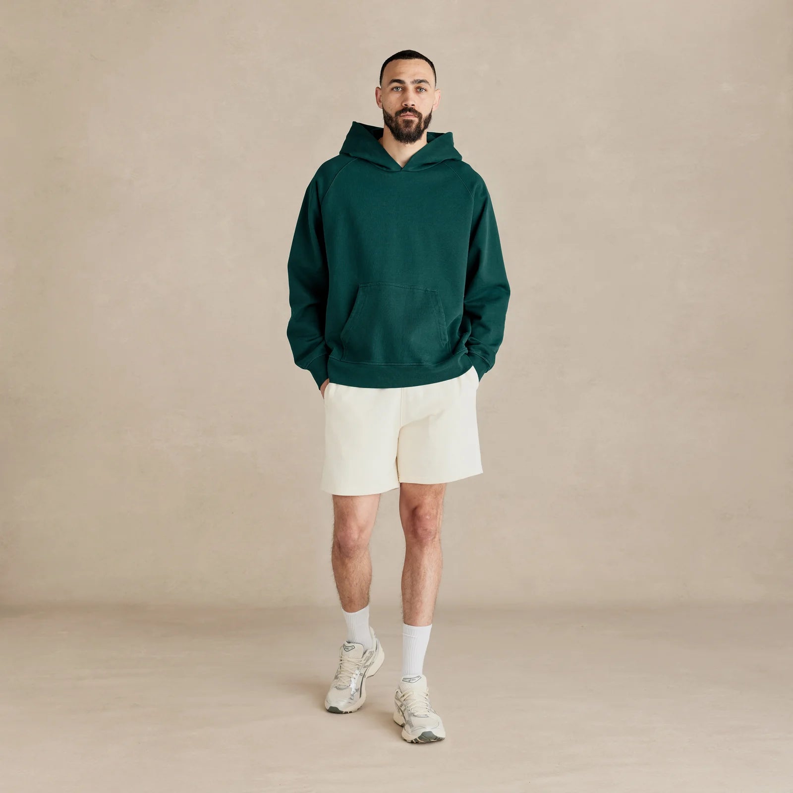 Unisex pine green oversized hoodie on model