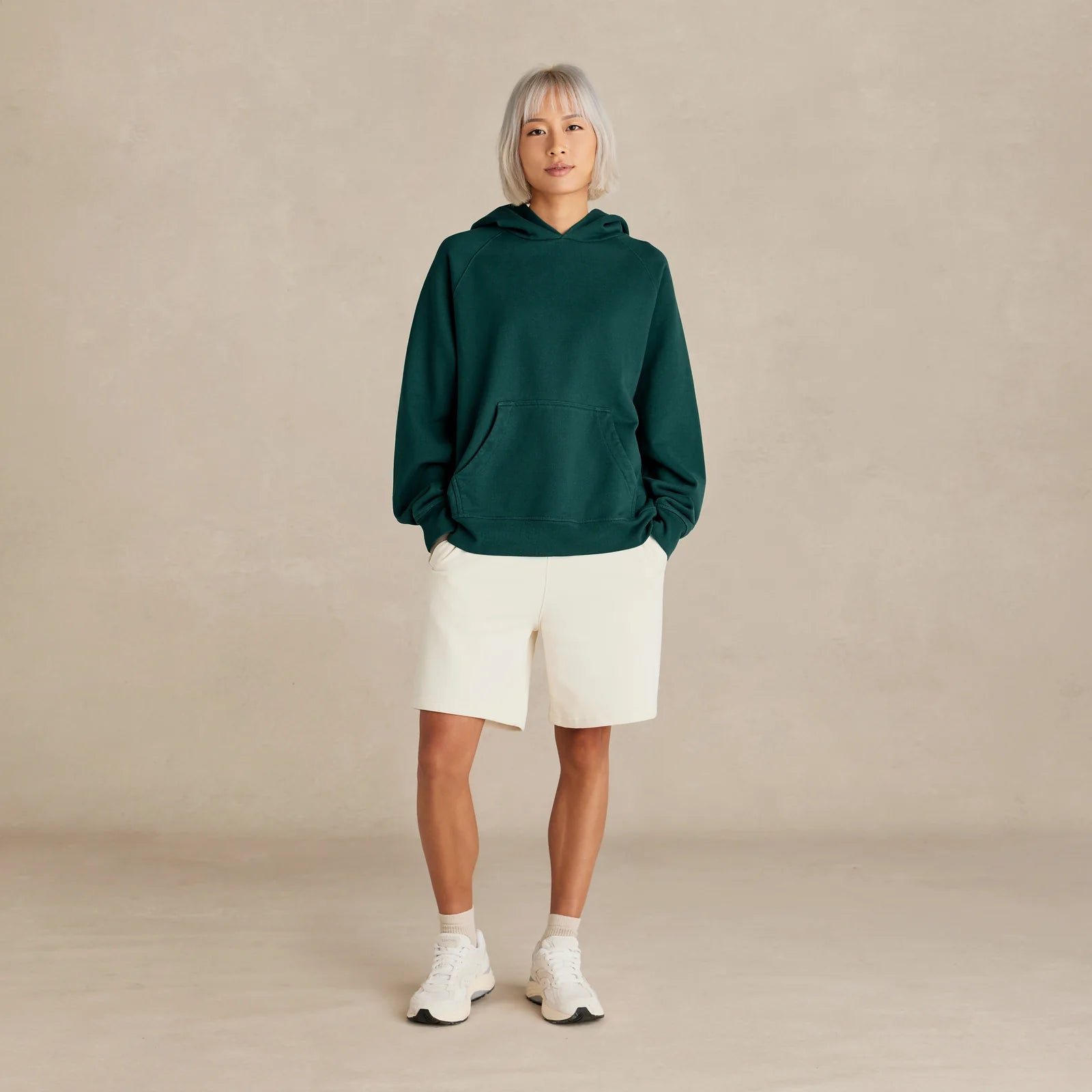 Unisex pine green oversized hoodie on model