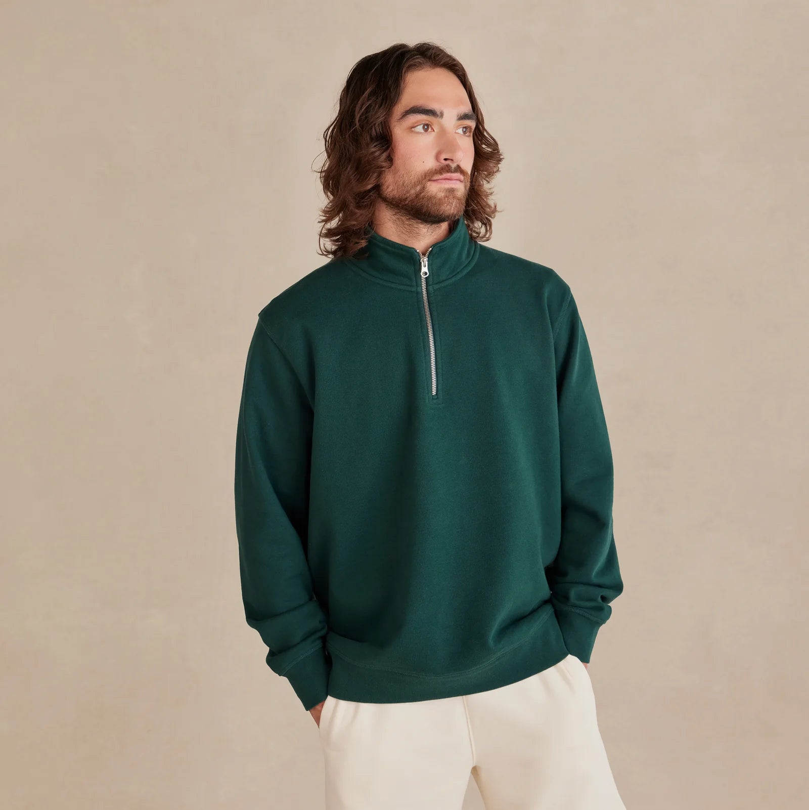The Traveler Pullover forest green sweatshirt worn by male model