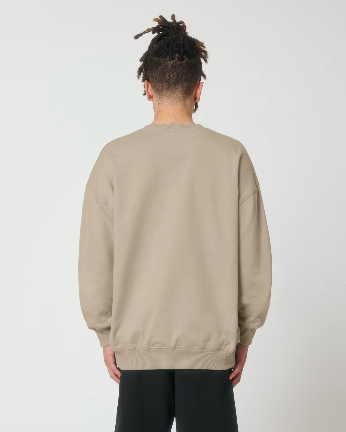 back view of a male model wearing a Brown light cotton hoodie in studio