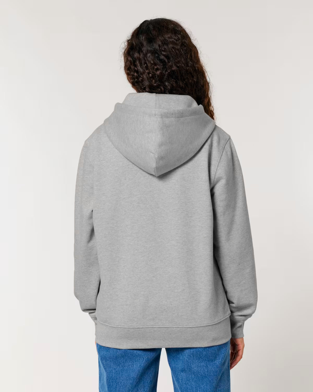 Person wearing a cotton gray hoodie from behind on a plain background