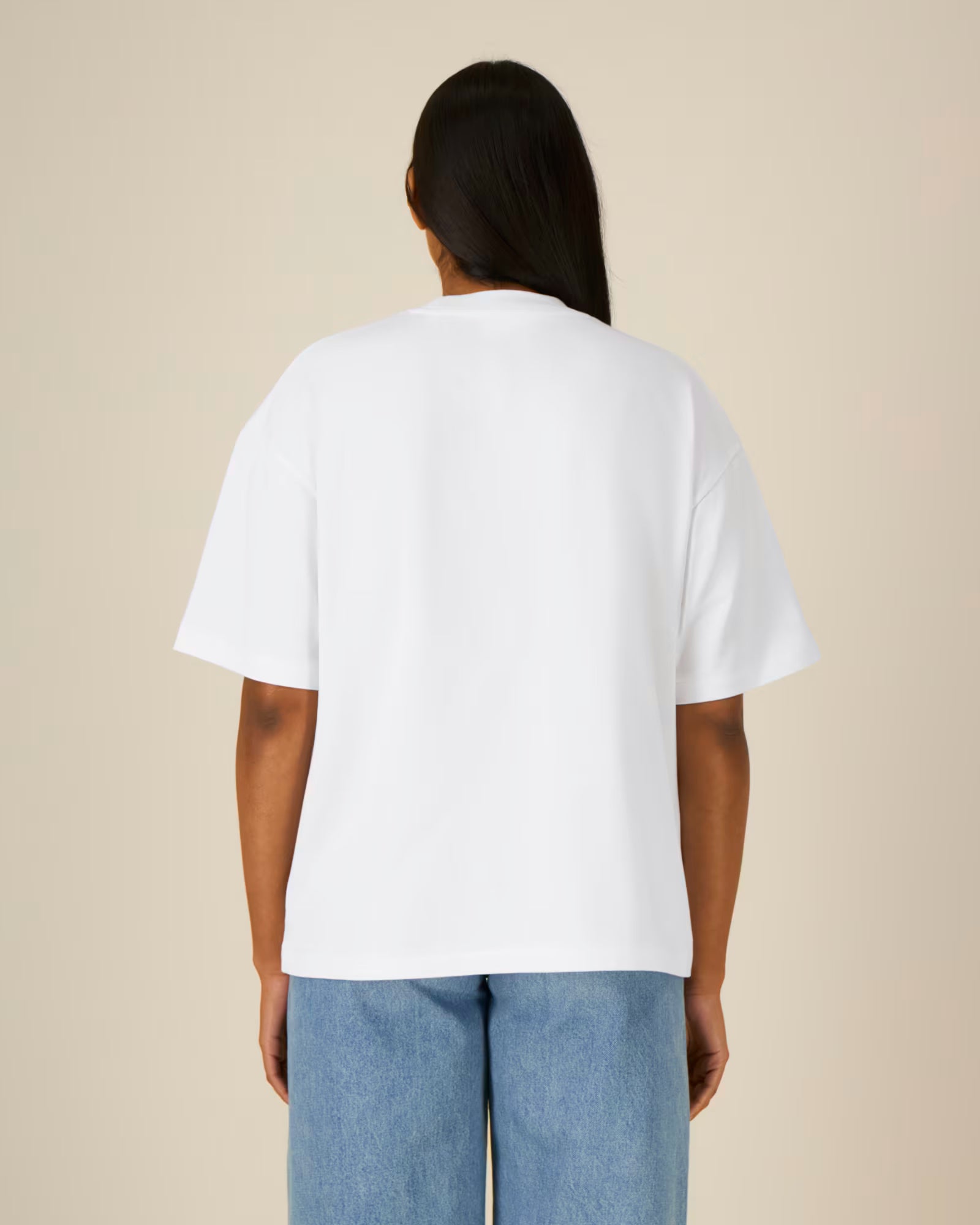 Back view of a model wearing a white cotton t-shirt in studio