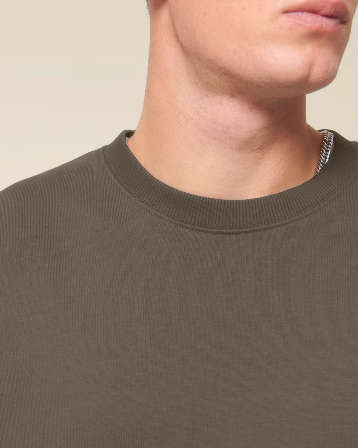 Front view detail of a brown unisex cotton hoodie isolated on white background