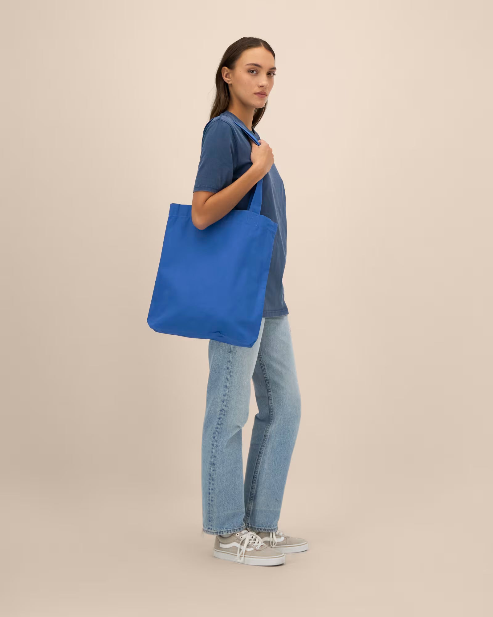 bright blue unisex canvas tote bag on model