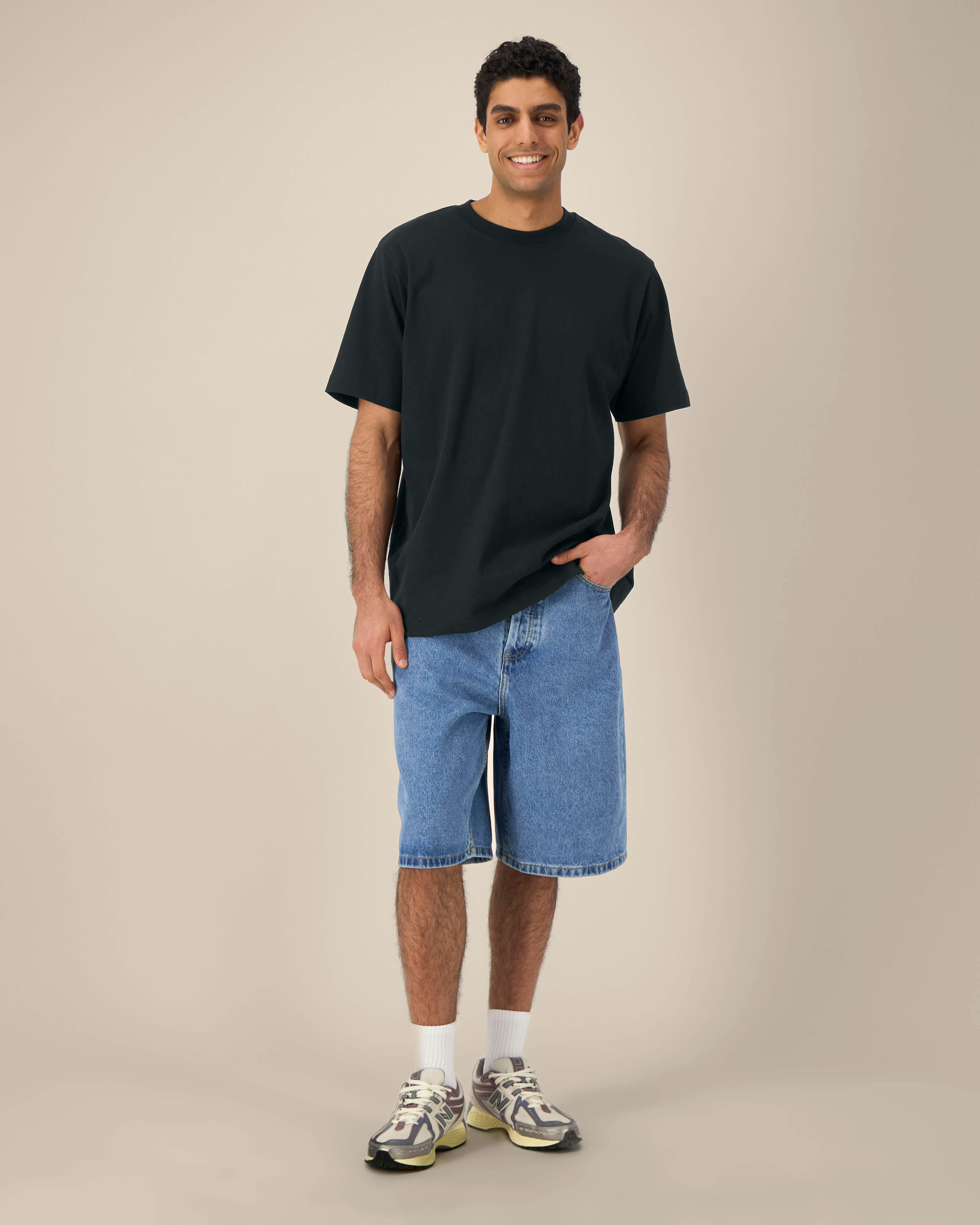 black unisex cotton t-shirt on model, relaxed fit