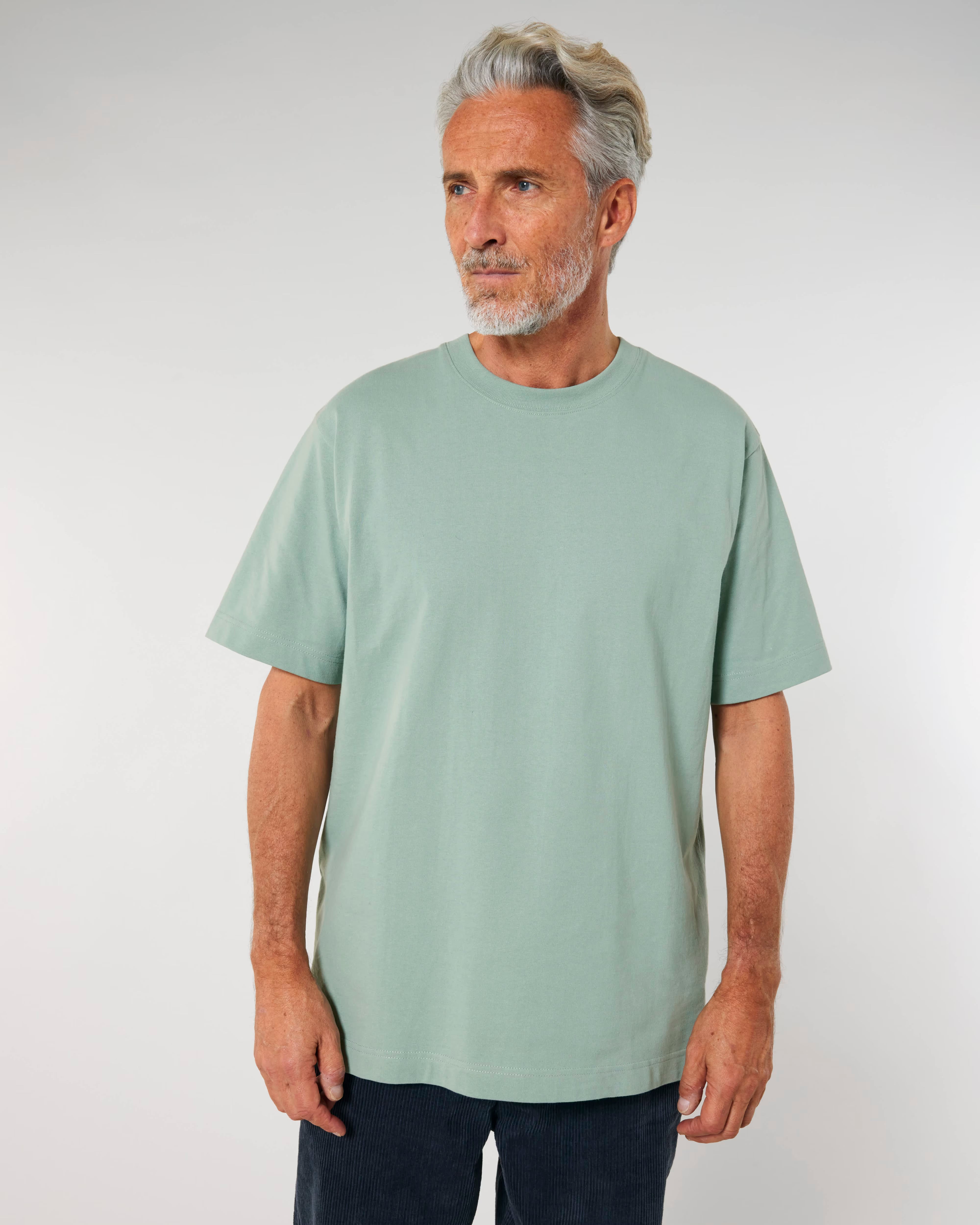 light sage green unisex cotton t-shirt on model, relaxed fit