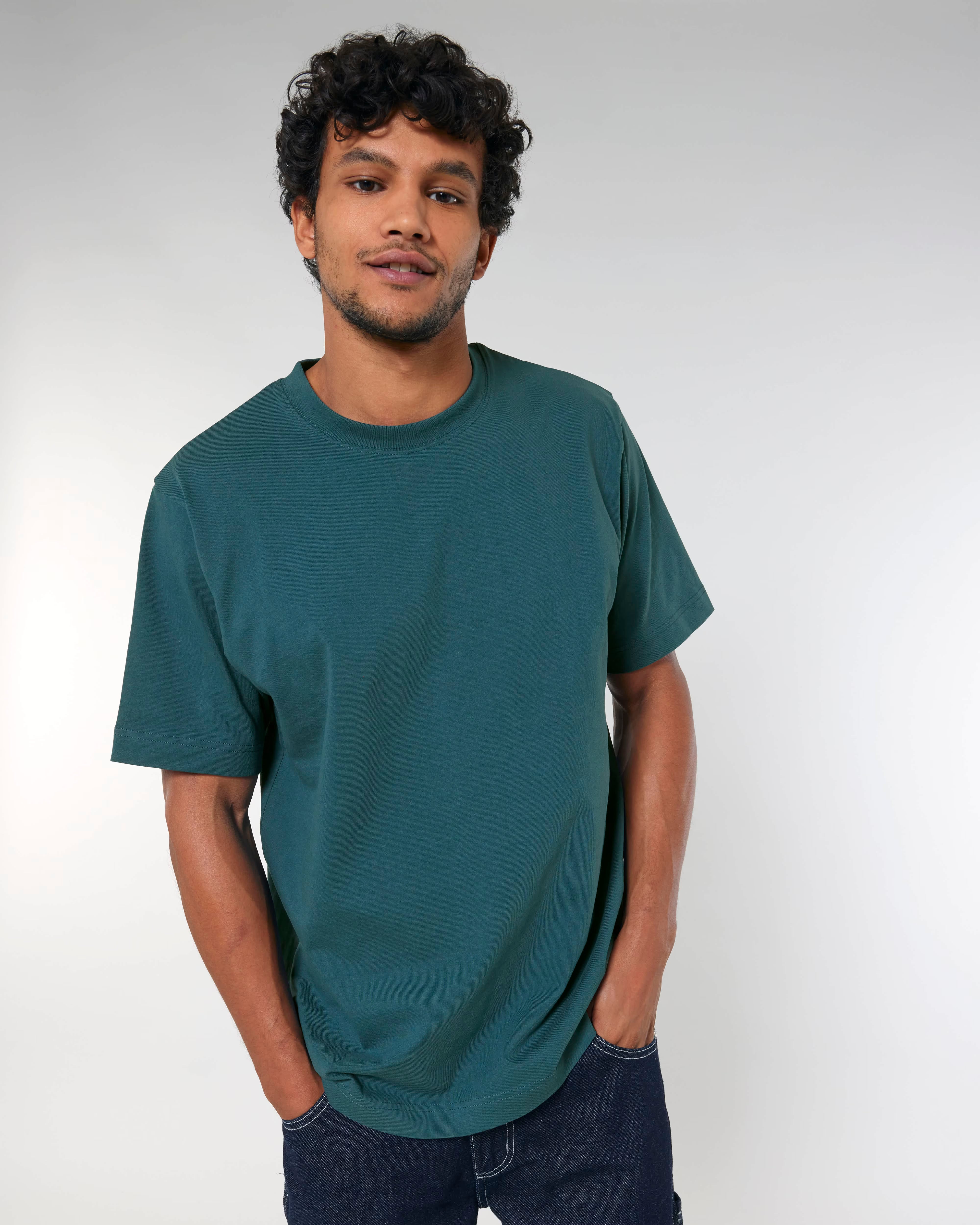 deep teal green unisex cotton t-shirt on model, relaxed fit