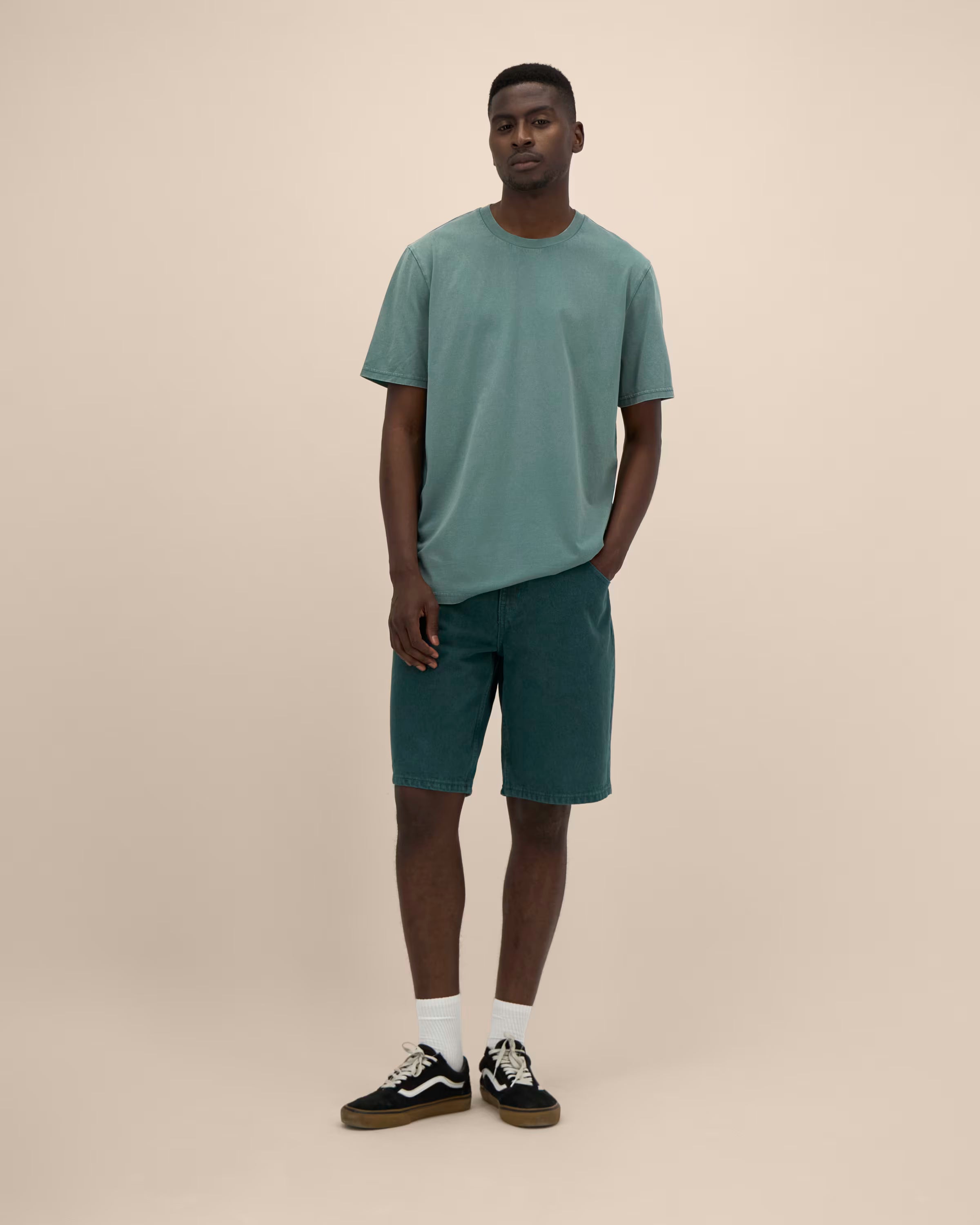 muted teal unisex cotton t-shirt on model