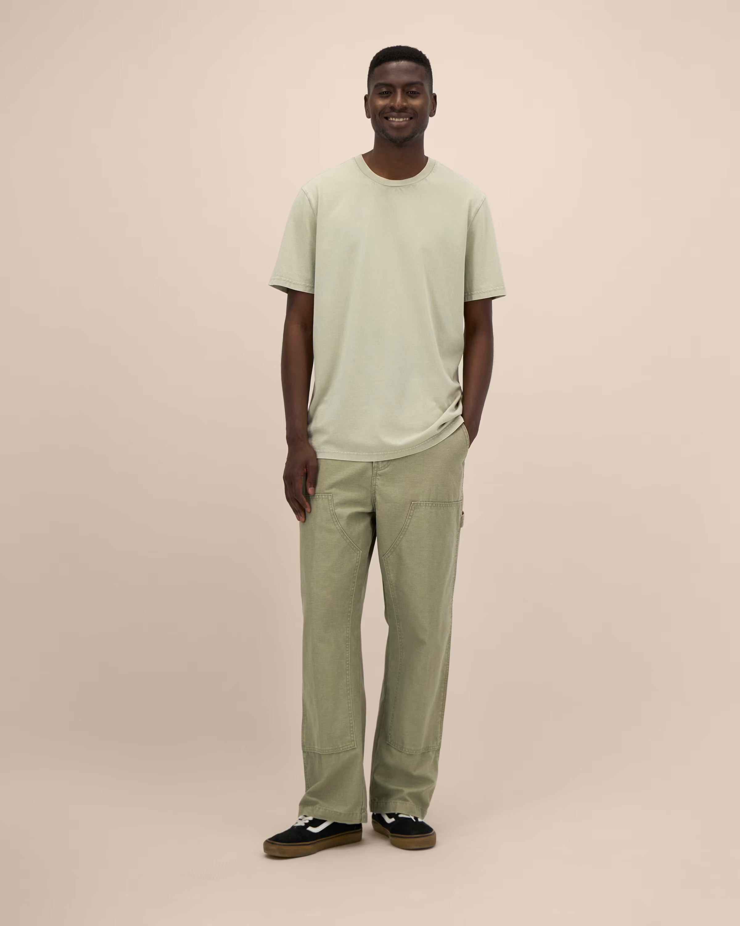 light sage green unisex cotton t-shirt on model