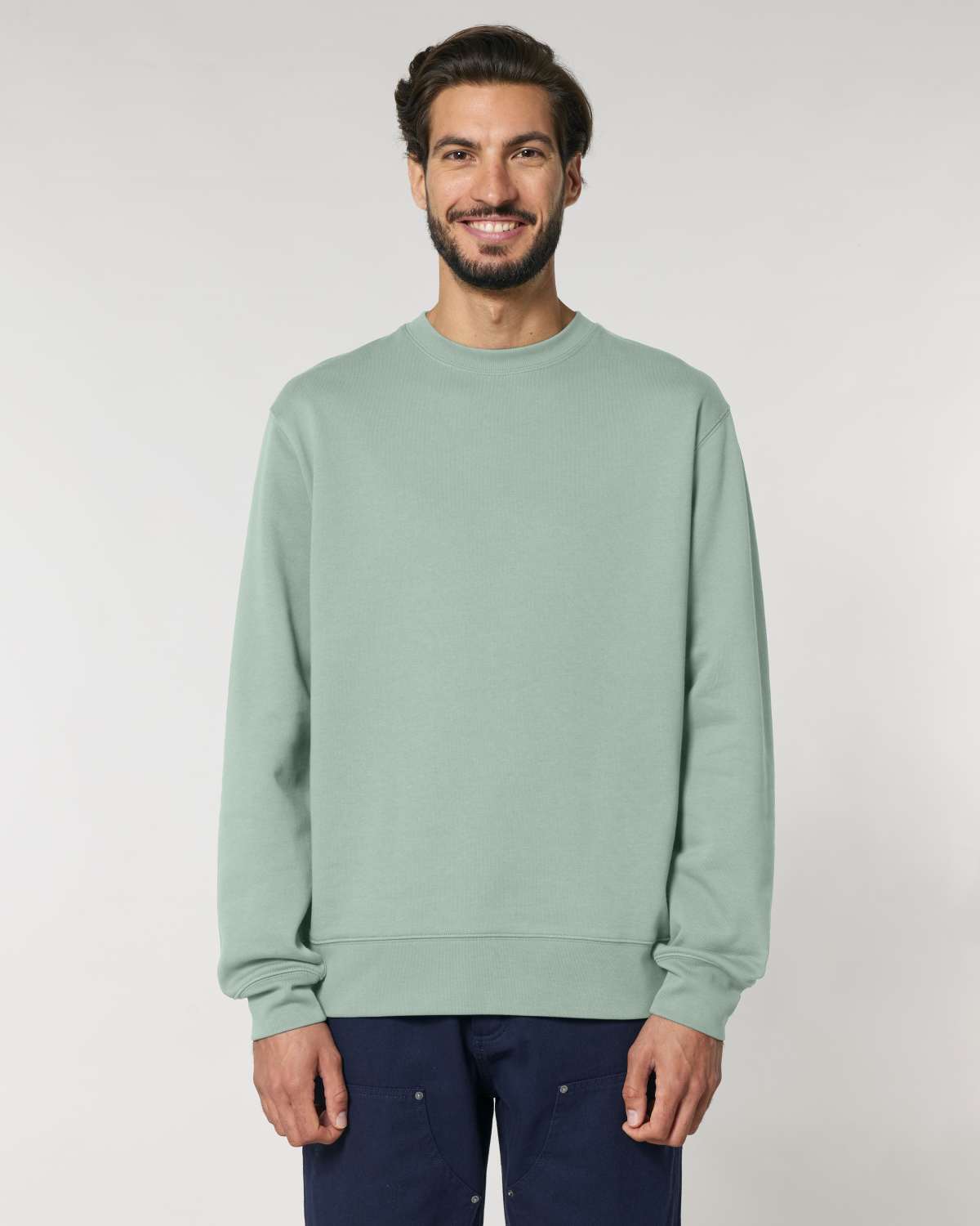 Man wearing a light green unisex cotton hoodie isolated on white background