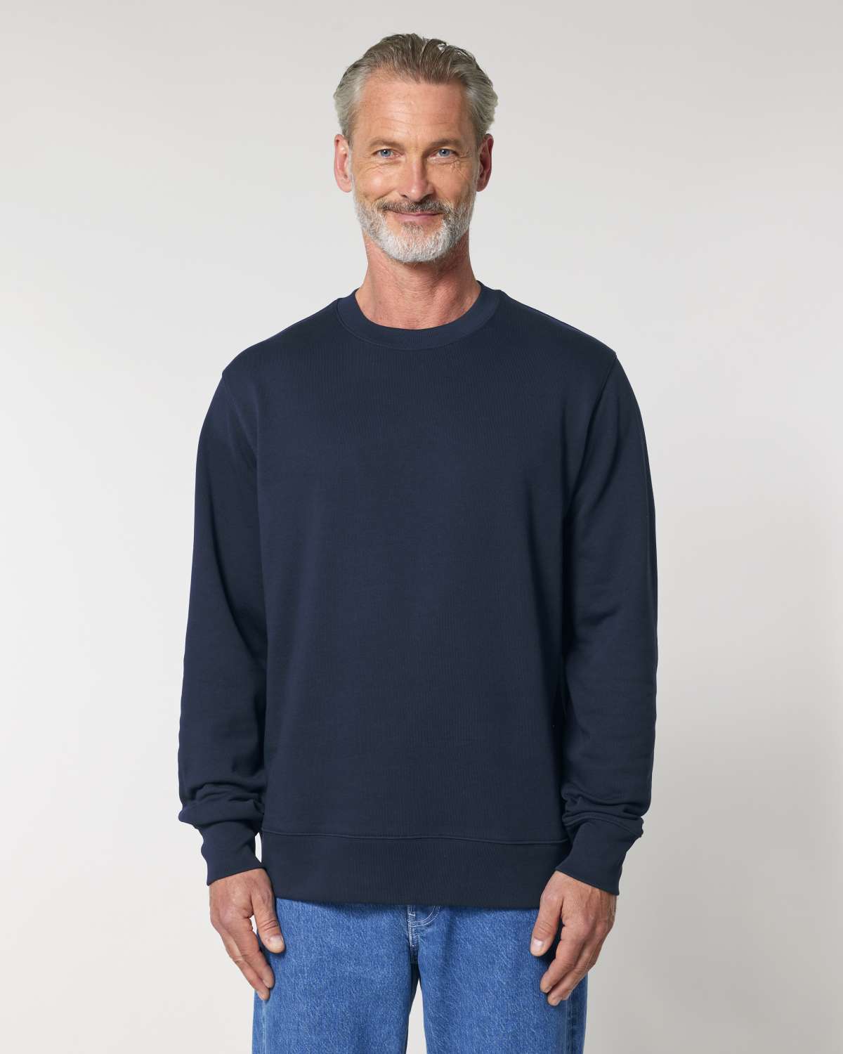 Man wearing a navy blue unisex cotton hoodie isolated on white background