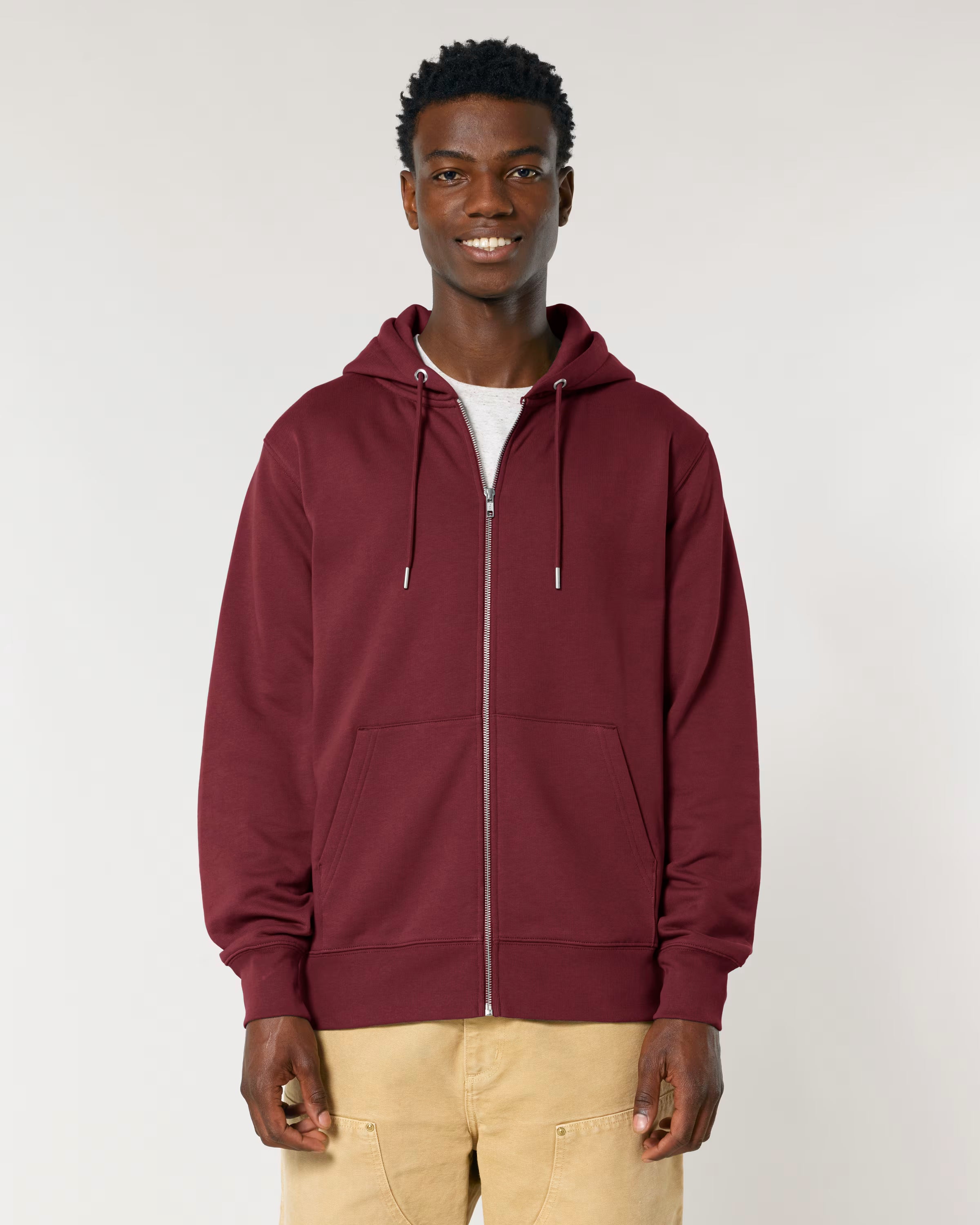 Man wearing a cotton maroon hoodie on a white background