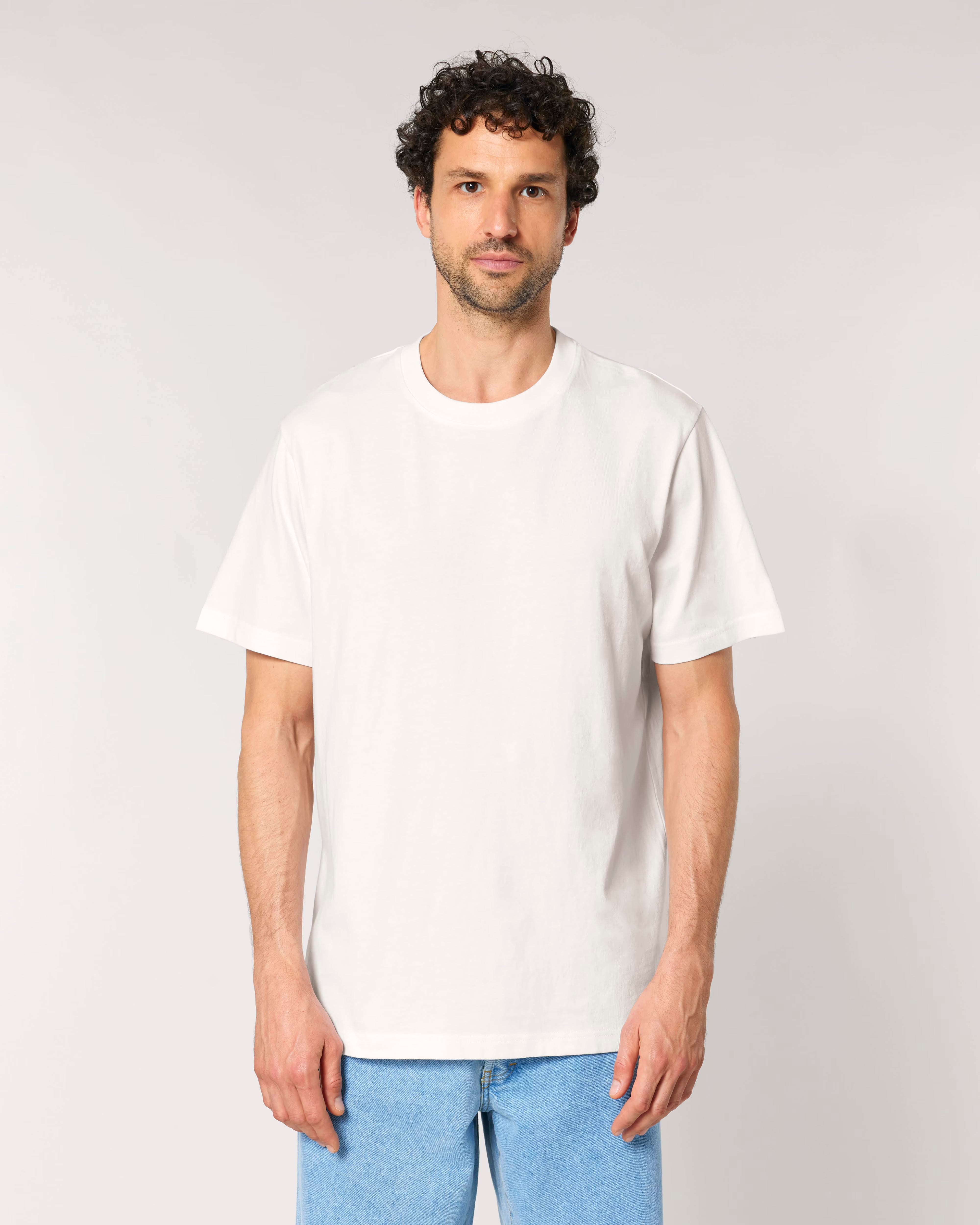 man wearing white oversized cotton t-shirt, sustainable everyday clothing