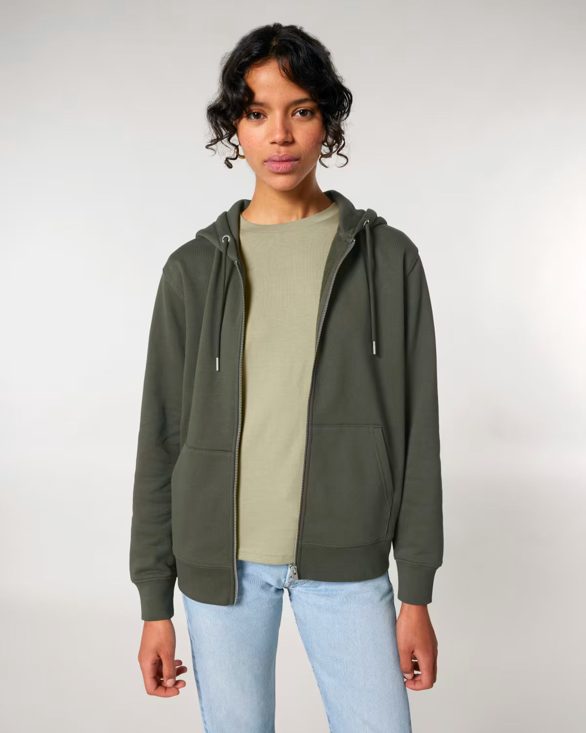 Front view of a male model wearing an olive green cotton hoodie in studio