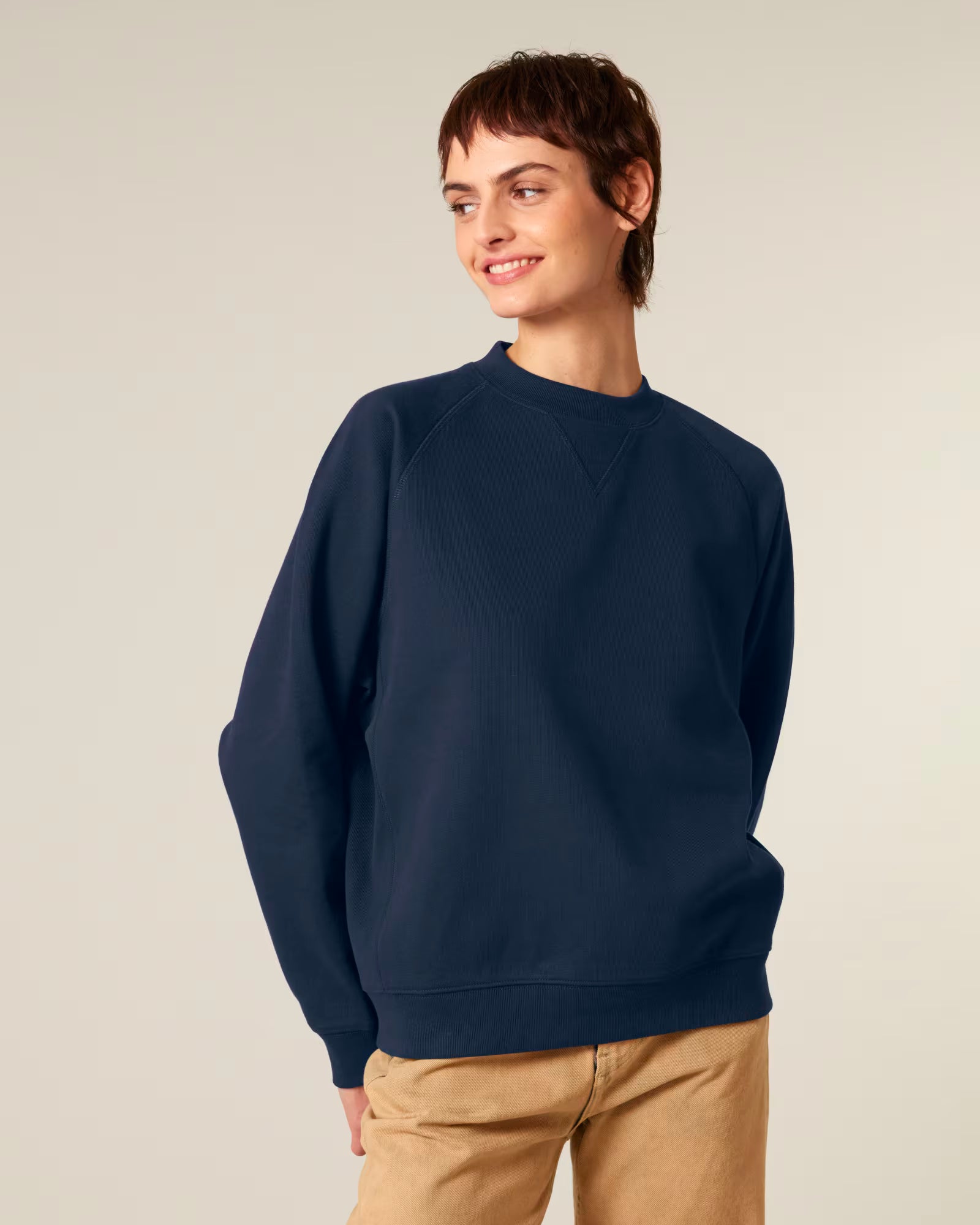 Front view of a male model wearing a navy cotton sweatshirt in studio