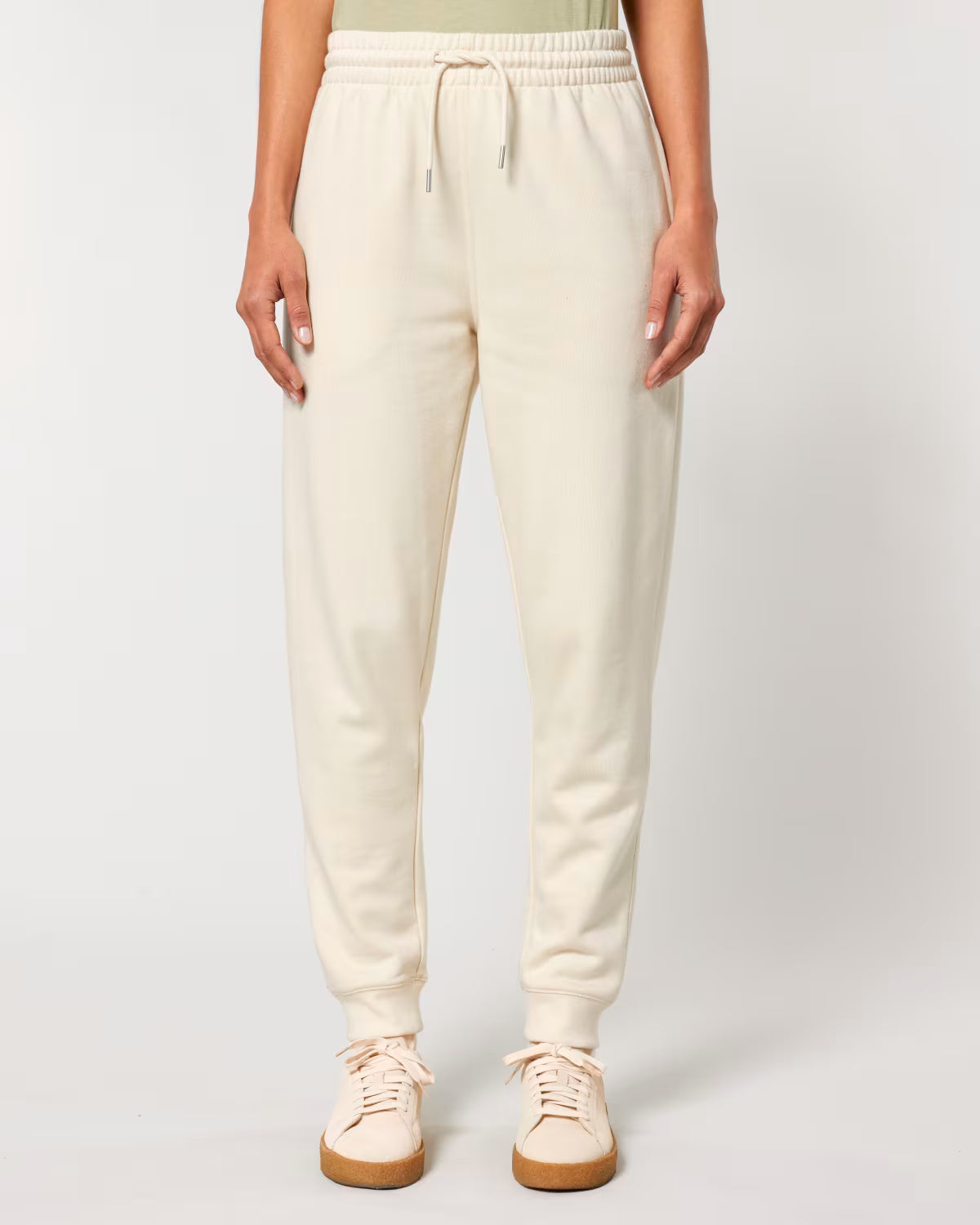 off-white jogger pants front view on model, eco-friendly custom merch clothing