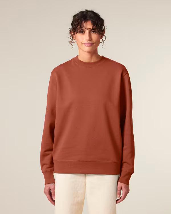 rust red unisex crewneck sweatshirt on model, relaxed fit