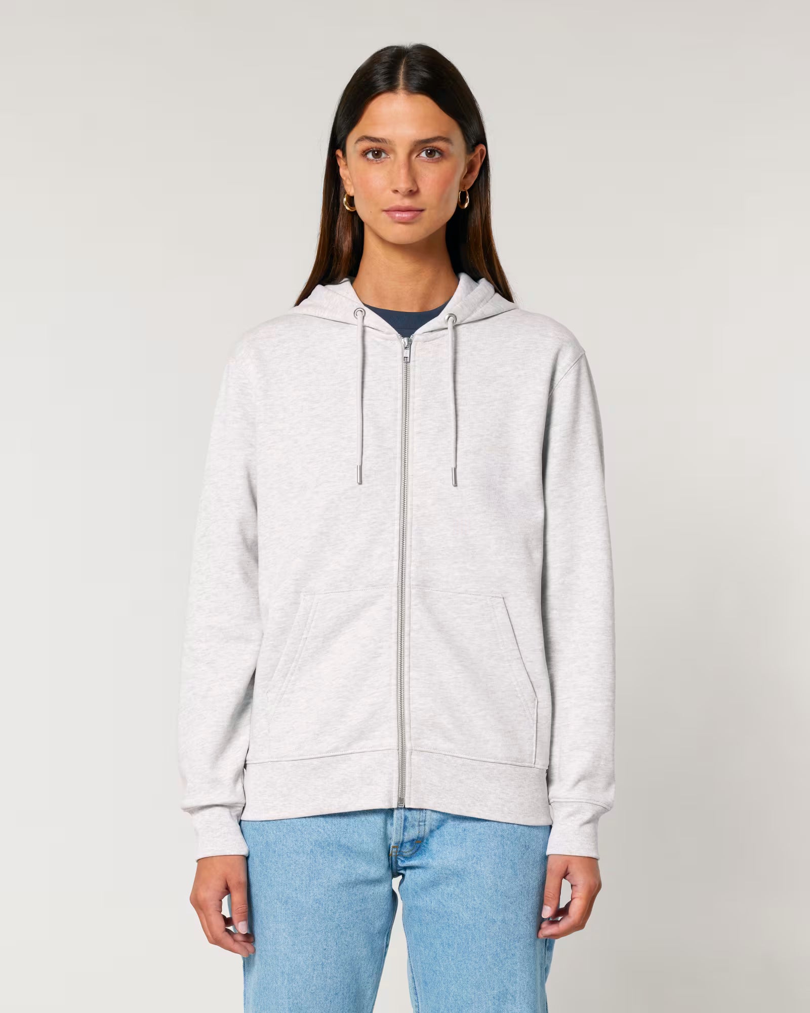 Front view of a female model wearing a white cotton hoodie in studio