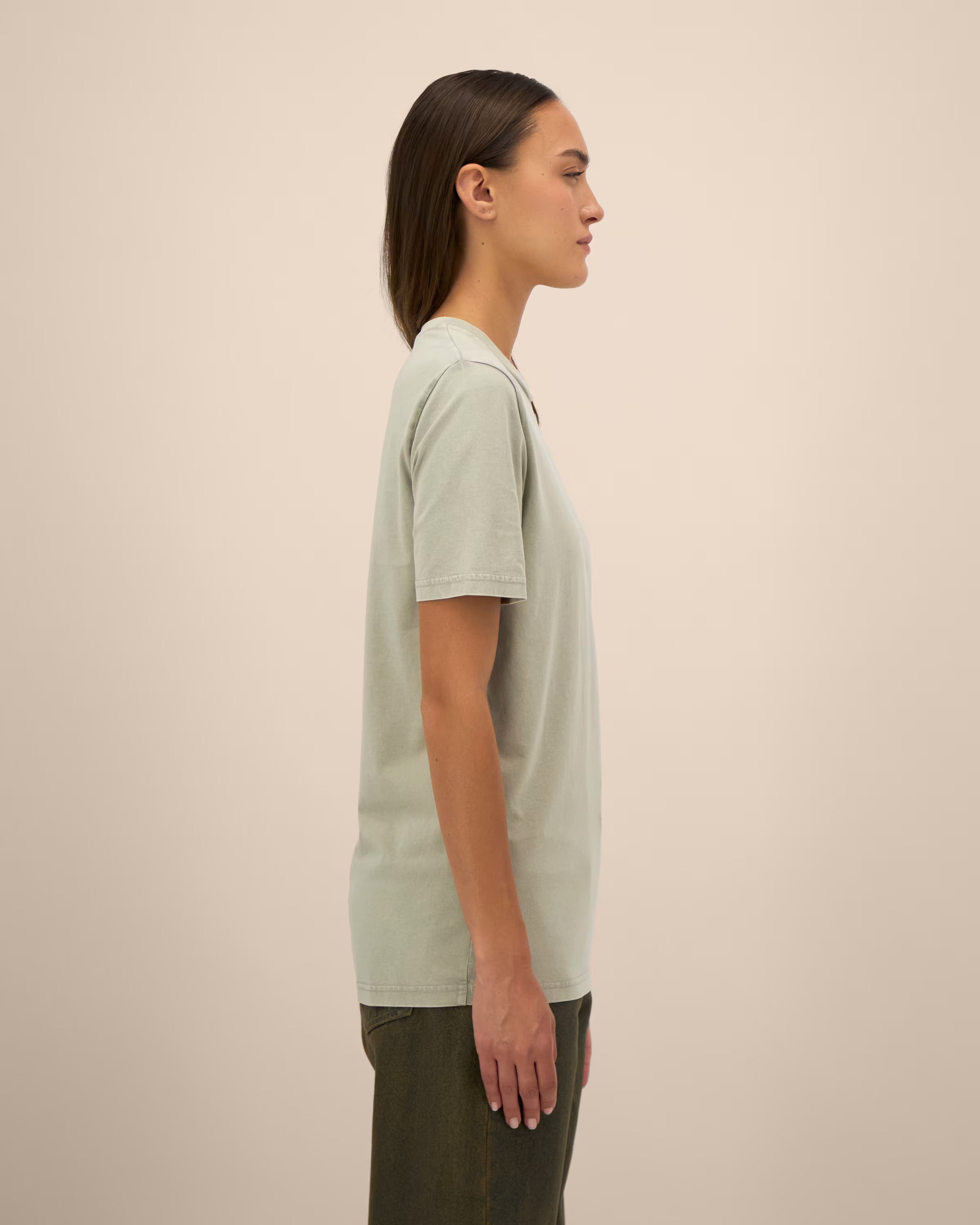 light sage green unisex cotton t-shirt on model