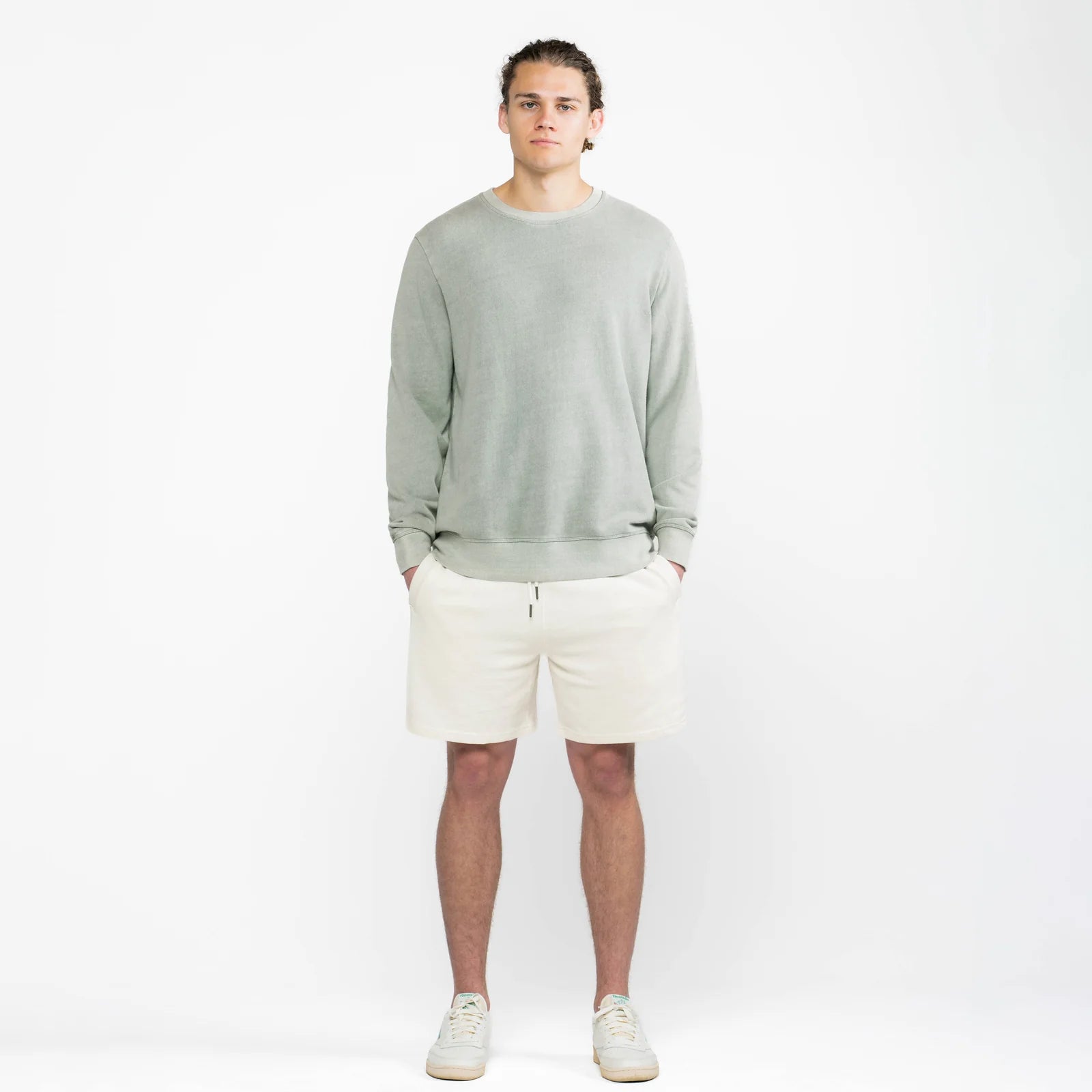 The Classic Crewneck sage sweatshirt worn by male model