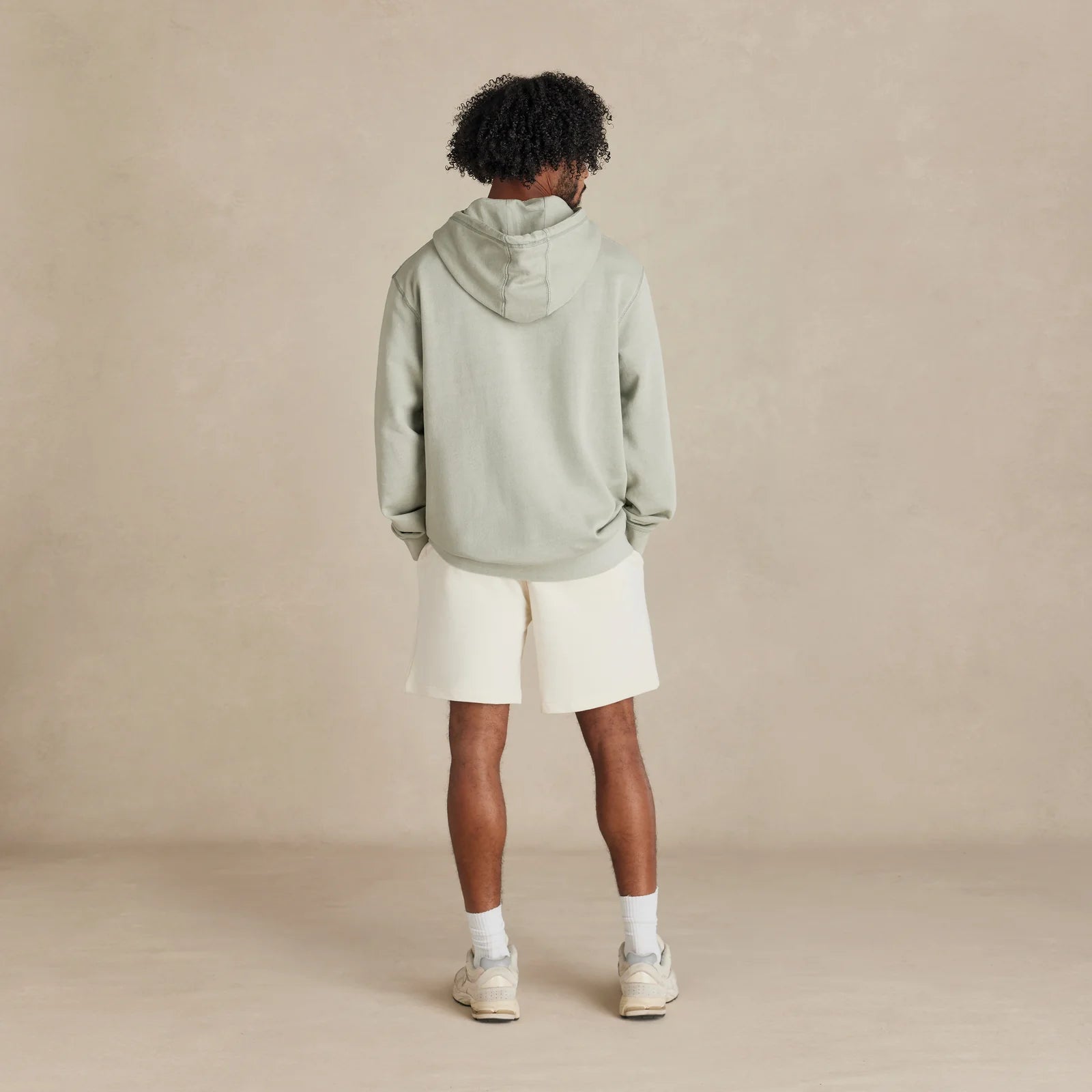 The Classic Hoodie sage hoodie worn by men model