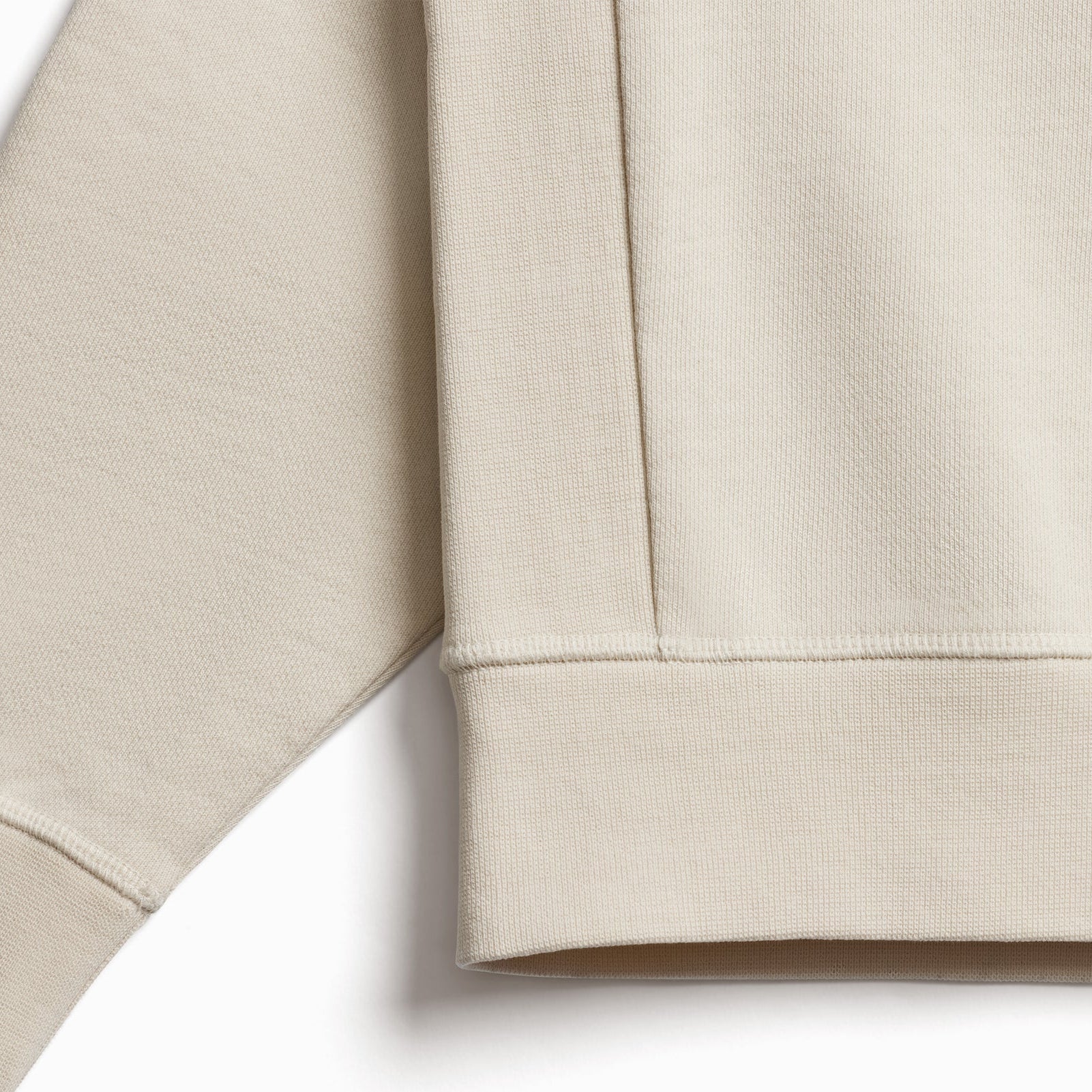 The Relaxed Crewneck cream organic cotton fabric texture close-up