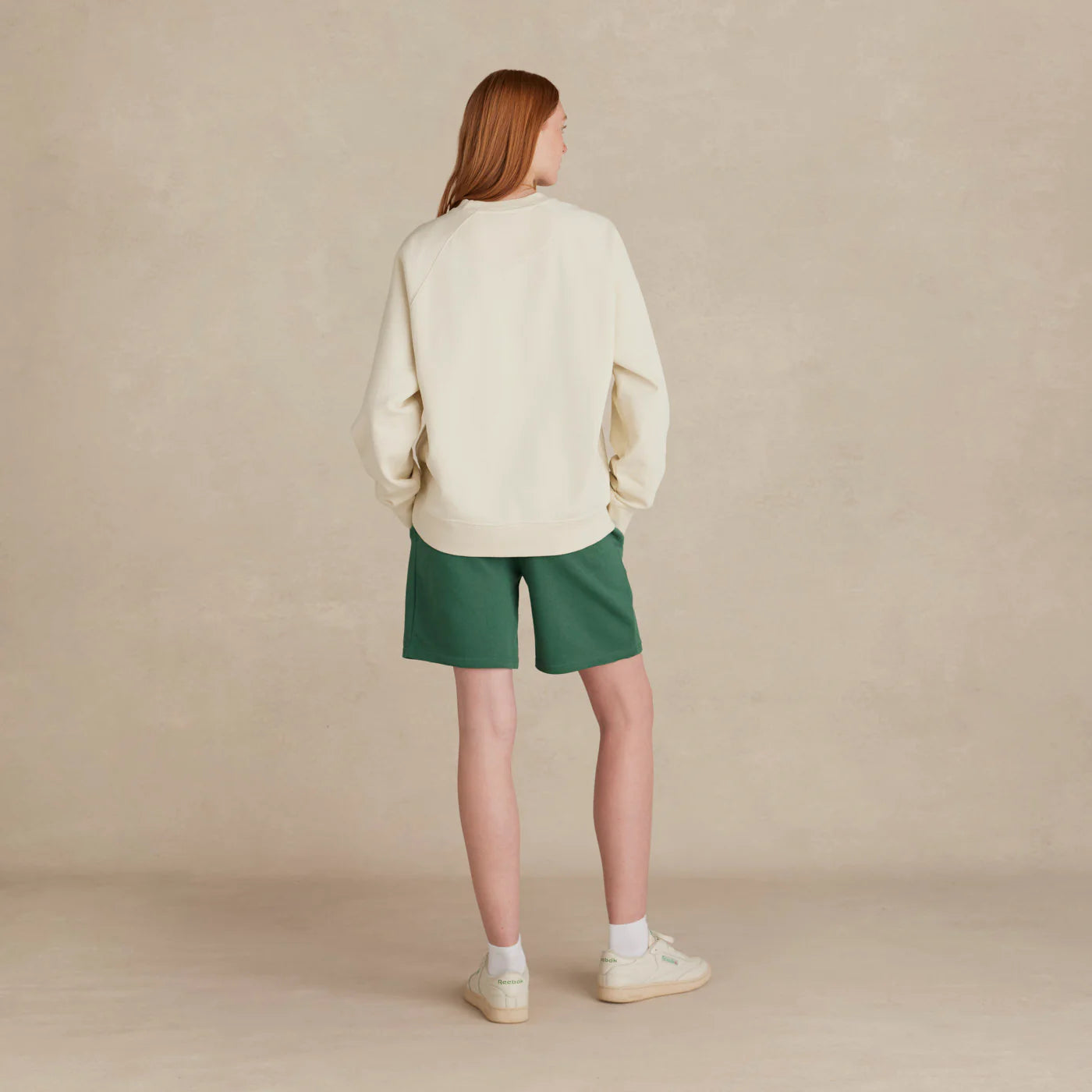 The Relaxed Crewneck cream sweatshirt back view on model