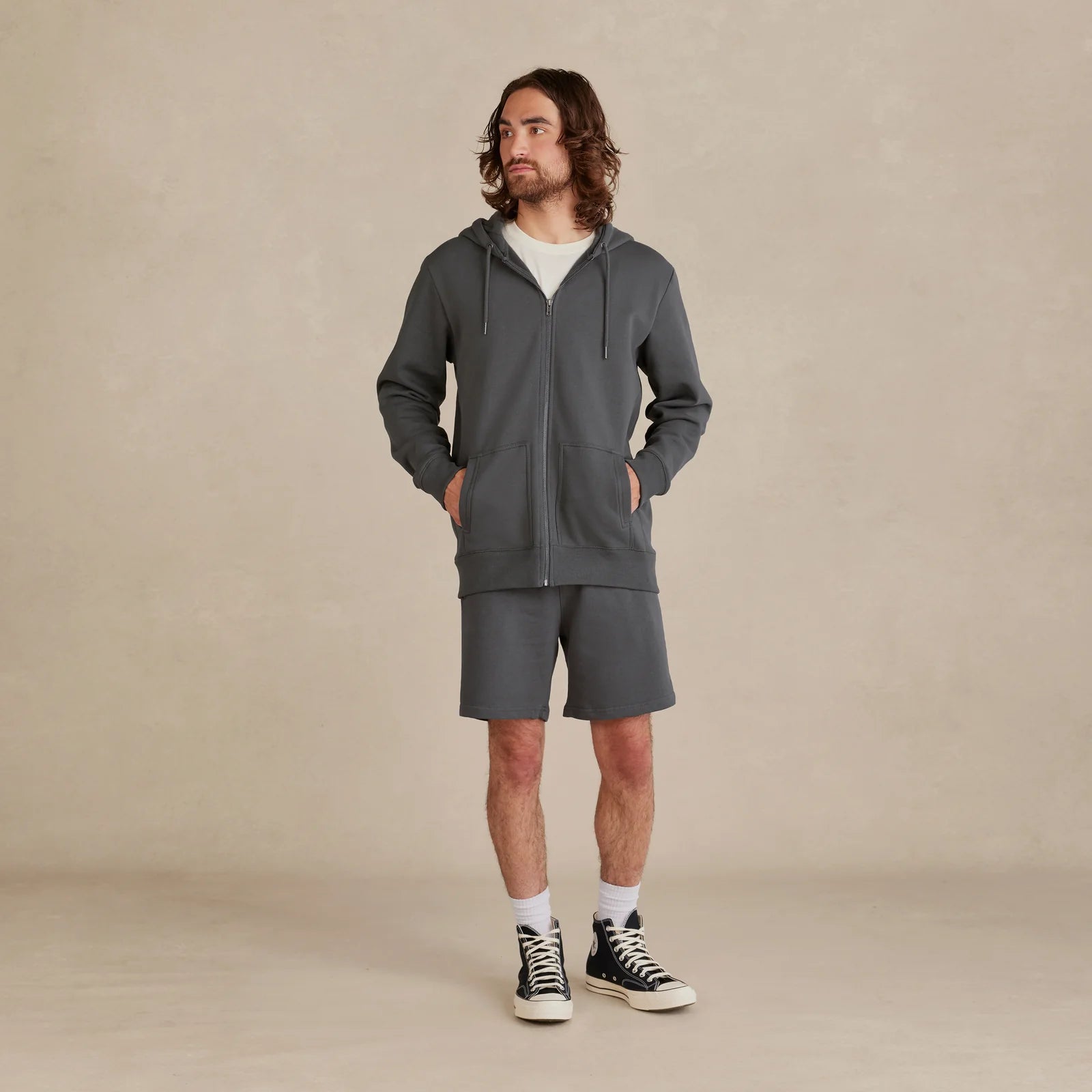 The Signature Zip gray zip hoodie worn by male model full body
