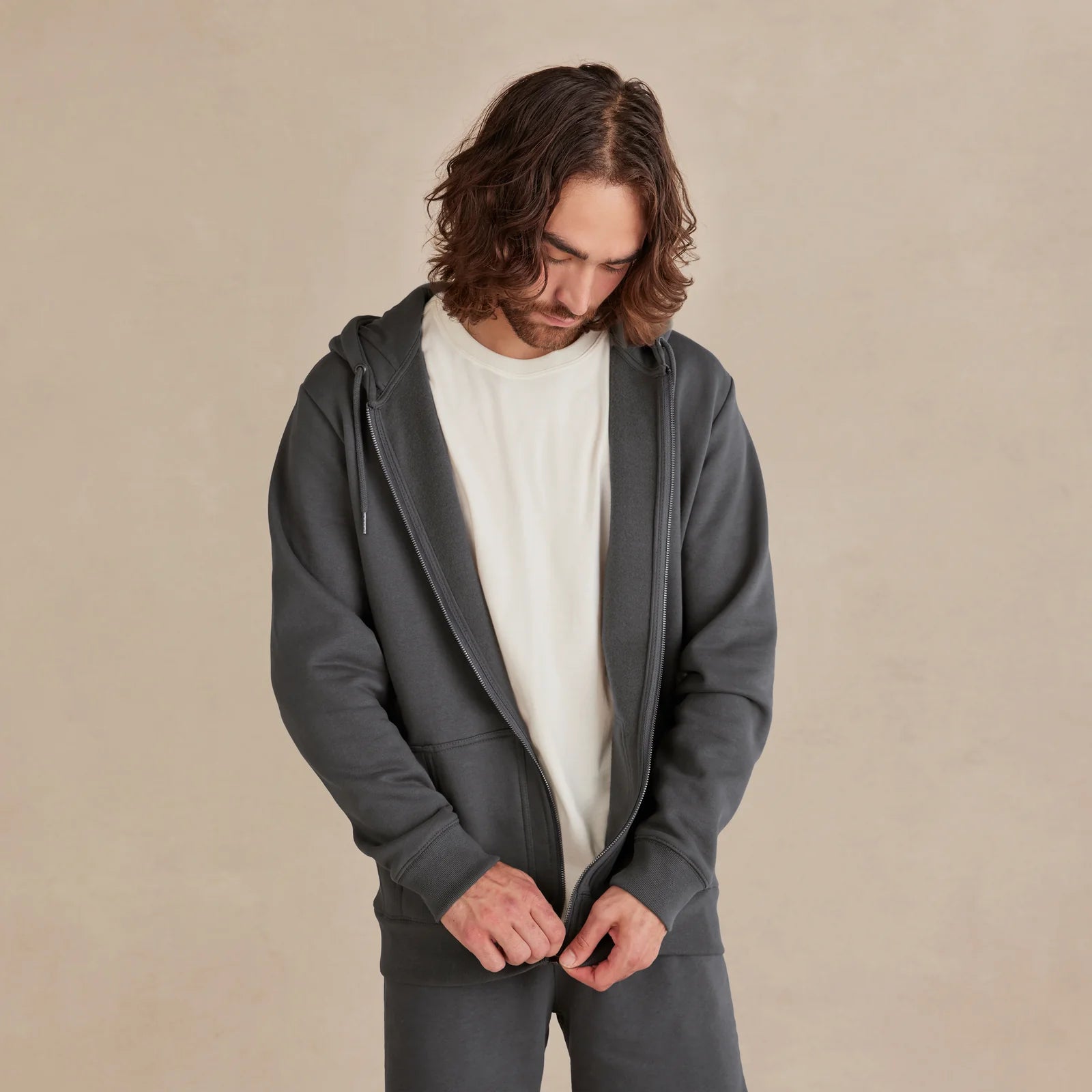 The Signature Zip gray zip hoodie worn by male model front view