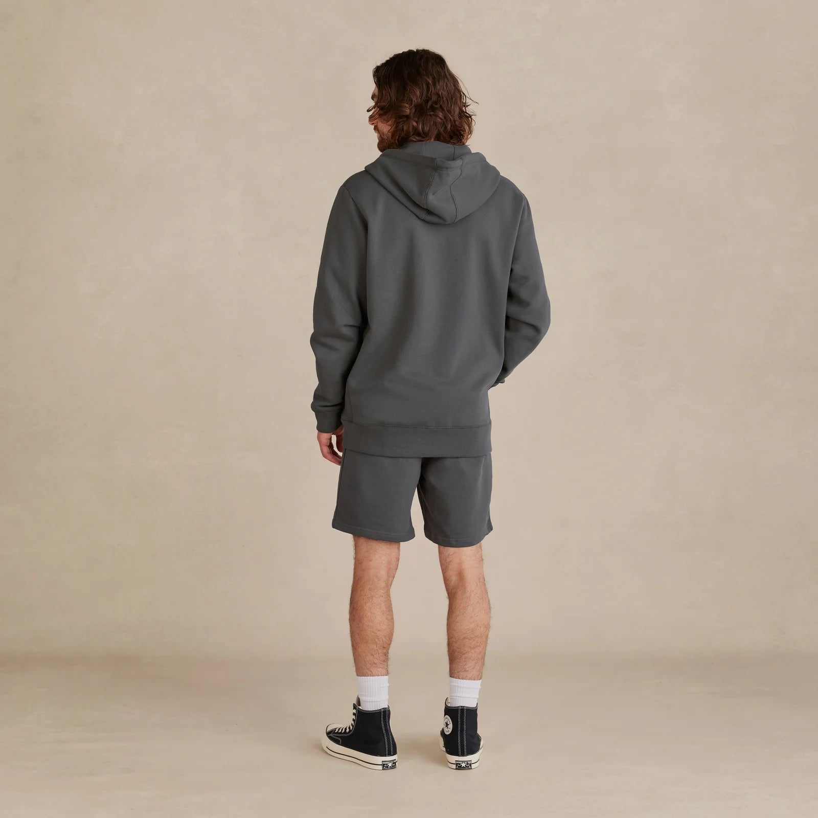 The Signature Zip black zip hoodie back view on model