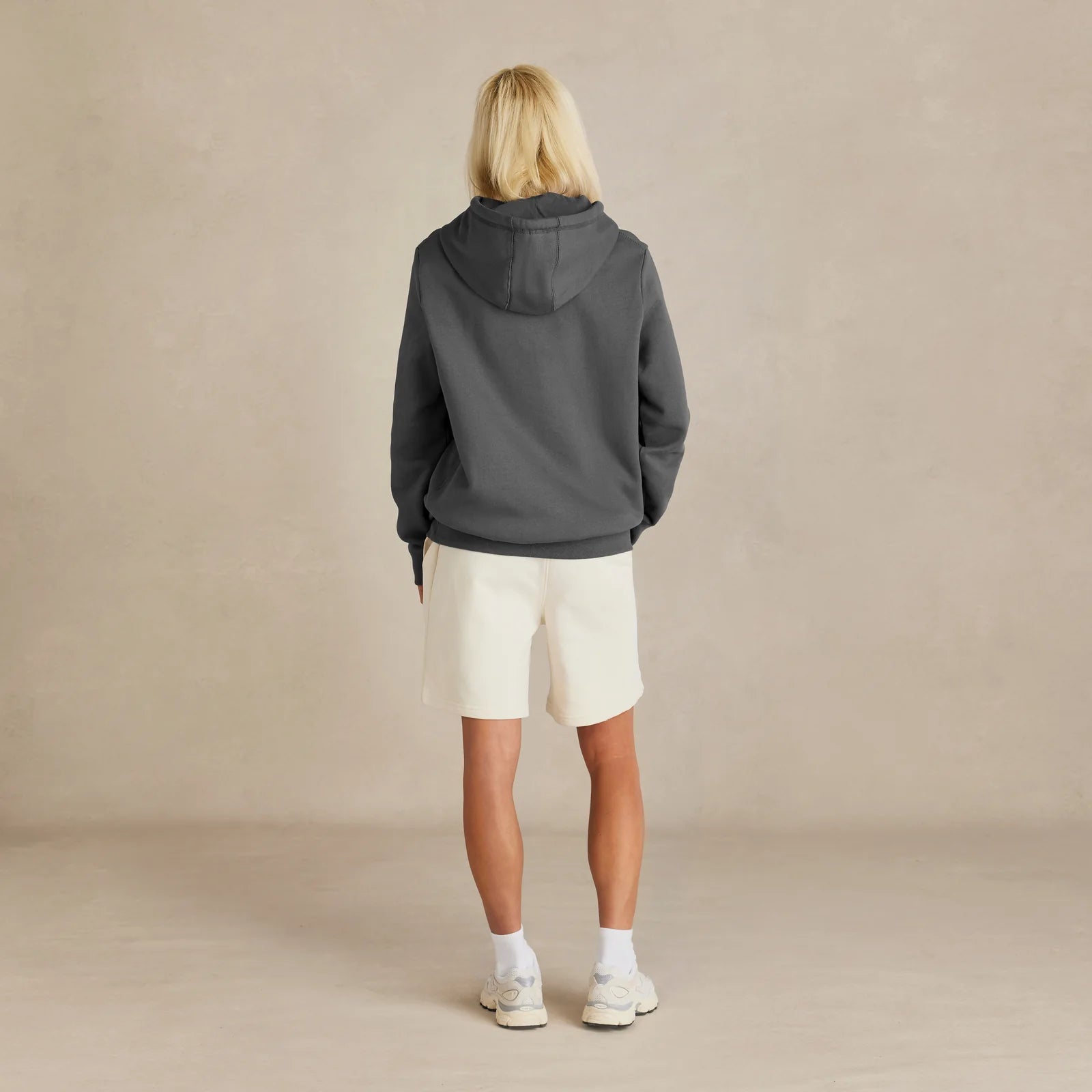 EMERCYN Essential Hoodie – dark grey women unisex premium cotton hoodie styled on male model