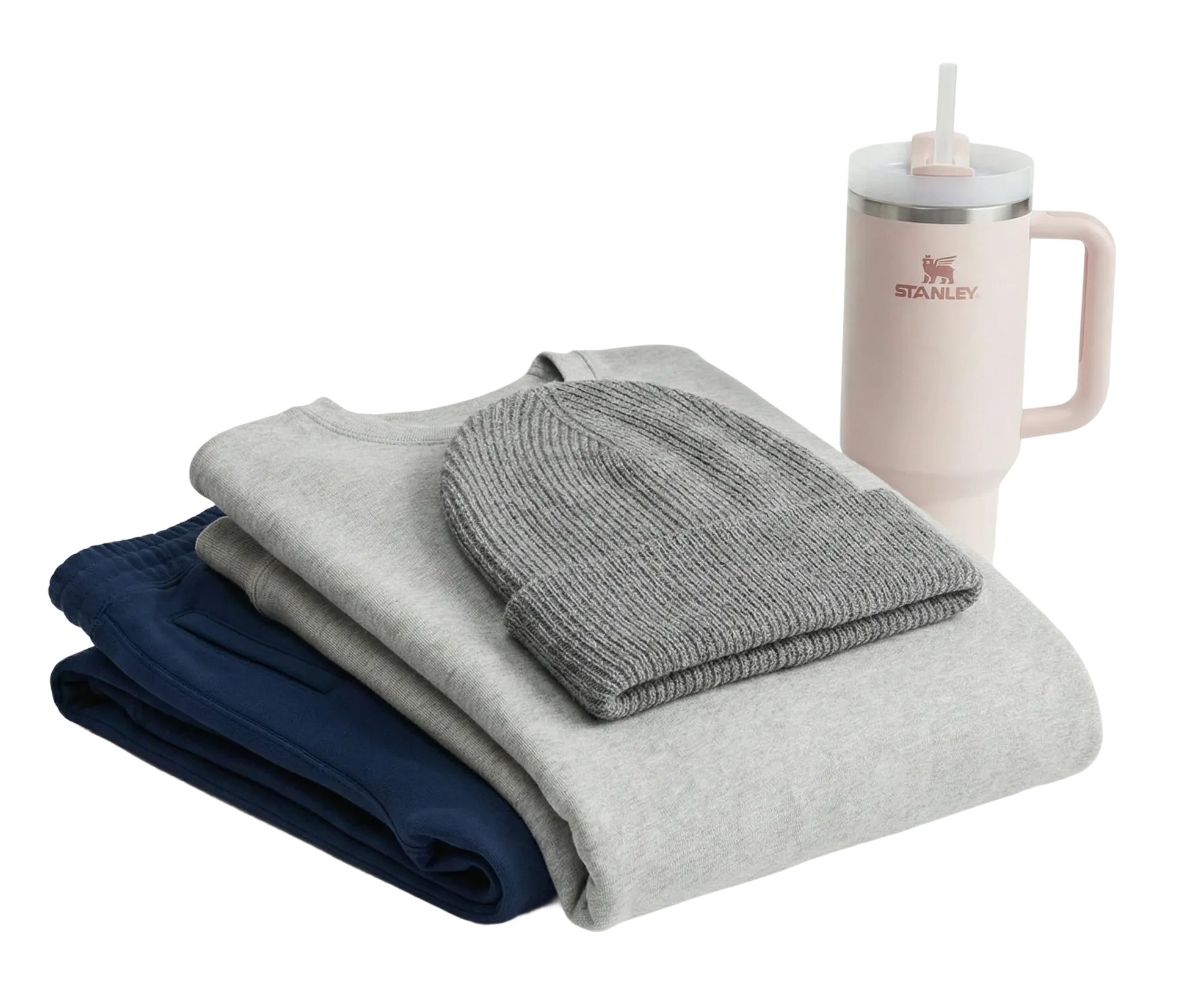 Stack of folded clothes with a gray beanie and a Stanley mug on a white background ideal for customization and printing