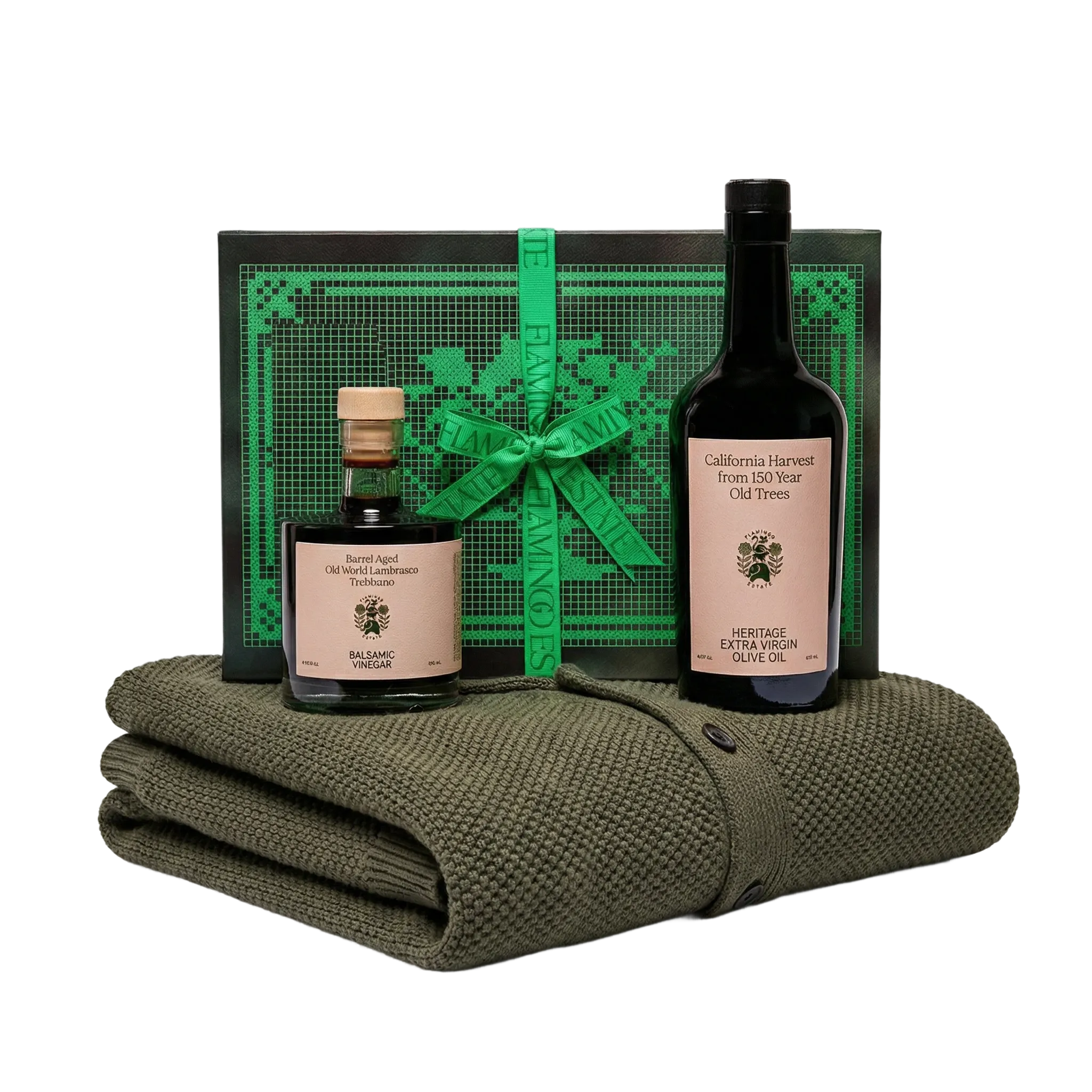 Two bottles of olive oil with a green blanket and decorative box on a white background